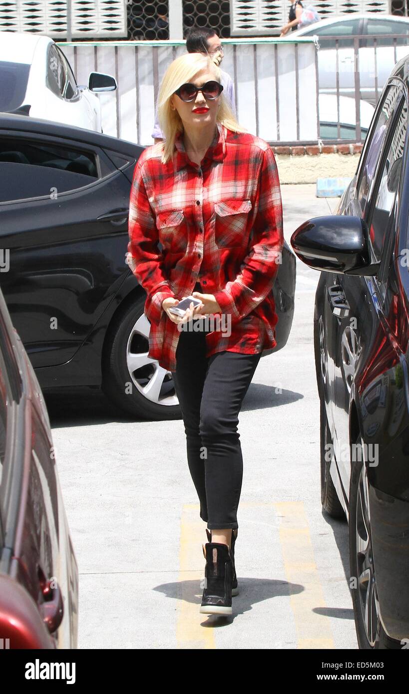 Gwen Stefani in an oversized red checked shirt, visits Jesun