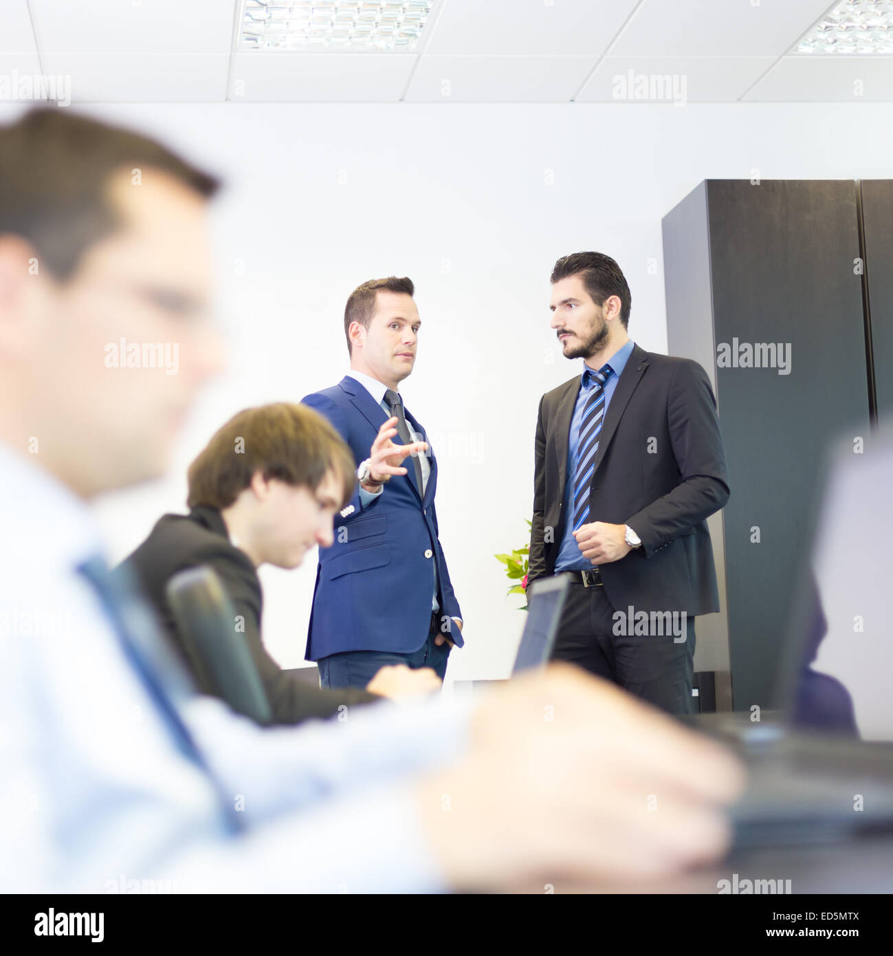 Business people in modern office. Stock Photo