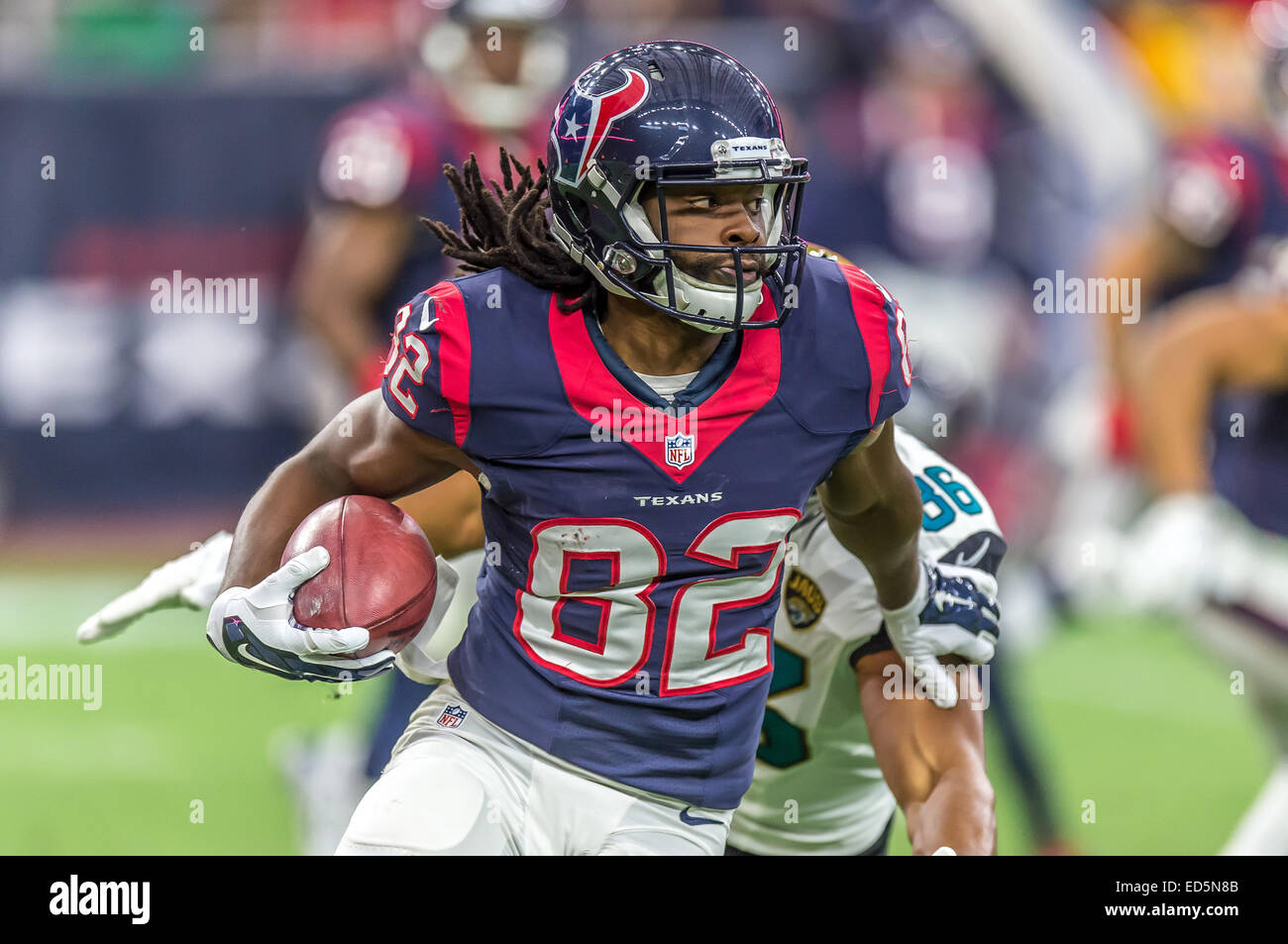 Houston, TX, USA. 27th Dec, 2020. Houston Texans wide receiver Keke Coutee  (16) runs with the ball as Cincinnati Bengals cornerback LeShaun Sims (38)  attempts to pull him down by his shirt