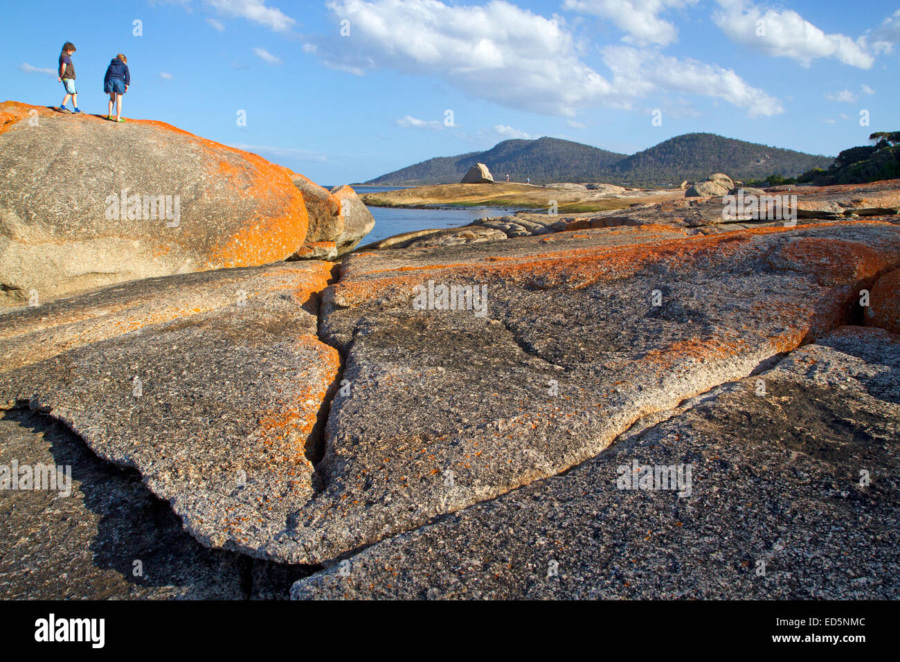 Climbing on rocks by the Blowhole in Bicheno Stock Photo - Alamy