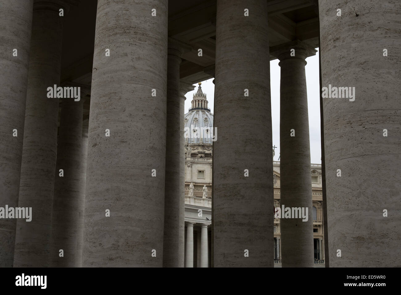 Saint Peter's Cupola seen through the Bernini's colonnade Stock Photo