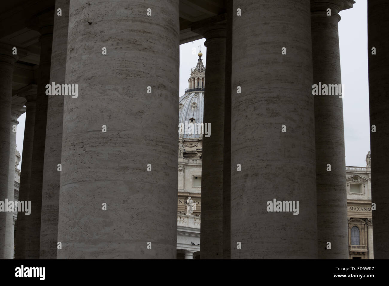 Saint Peter Cupola seen through the Bernini's colonnade Stock Photo