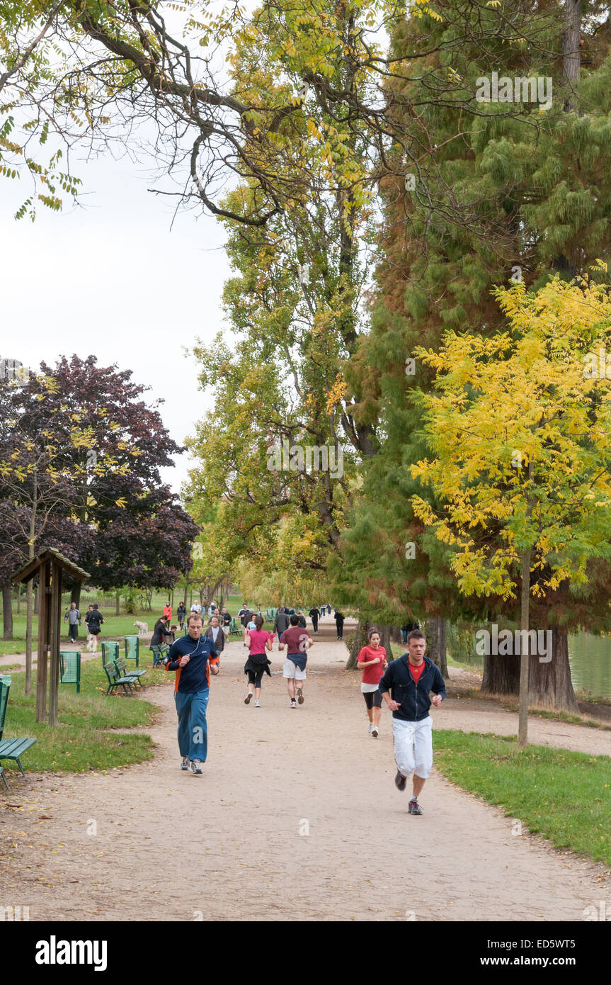 People jogging in Bois de Vincennes park, Paris, France Stock Photo