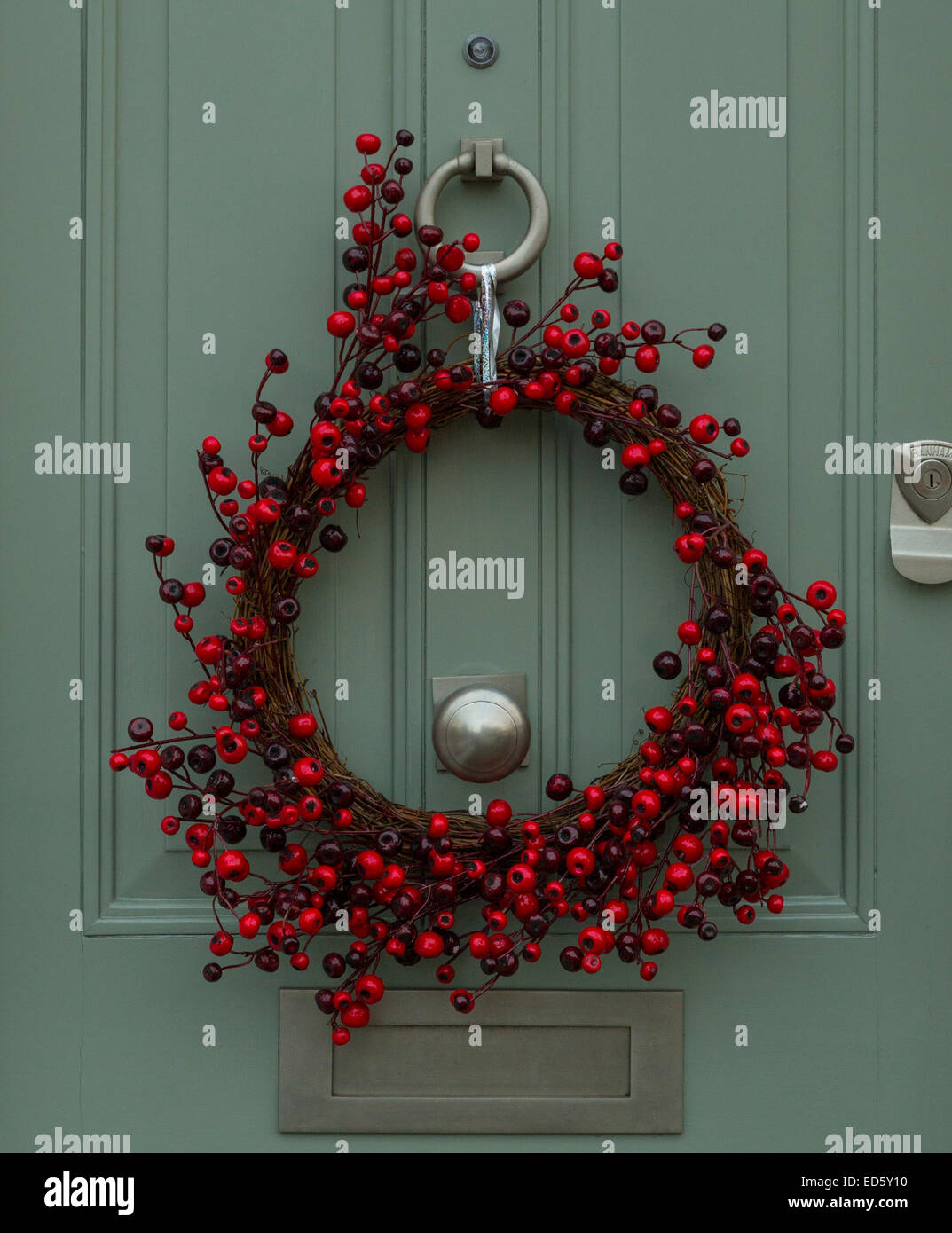 Christmas decoration on a green wooden door Stock Photo