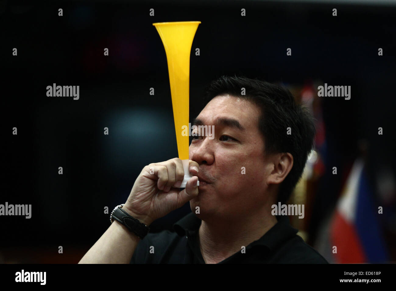 (141229) -- MAKATI CITY, Dec. 29, 2014 (Xinhua) -- A trader blows a toy trumpet during the last trading day of 2014 at the Philippine Stock Exchange in Makati City, the Philippines, Dec. 29, 2014. Philippine stock index rose 0.62 percent on its last trading day for the year. It ended the year at a two-week high of 7,230.57, rising 22.8 percent in 2014, among the region's outperformers.(Xinhua/Rouelle Umali)(zhf) Stock Photo