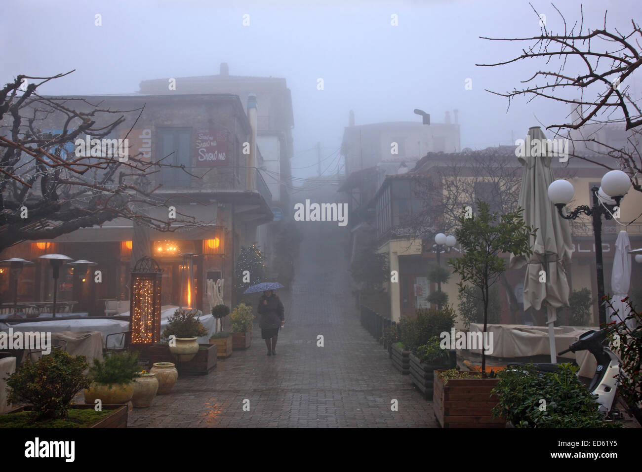 Night falling on misty Arachova, the most popular winter resort in Greece, Mount Parnassos, Viotia., Central Greece. Stock Photo