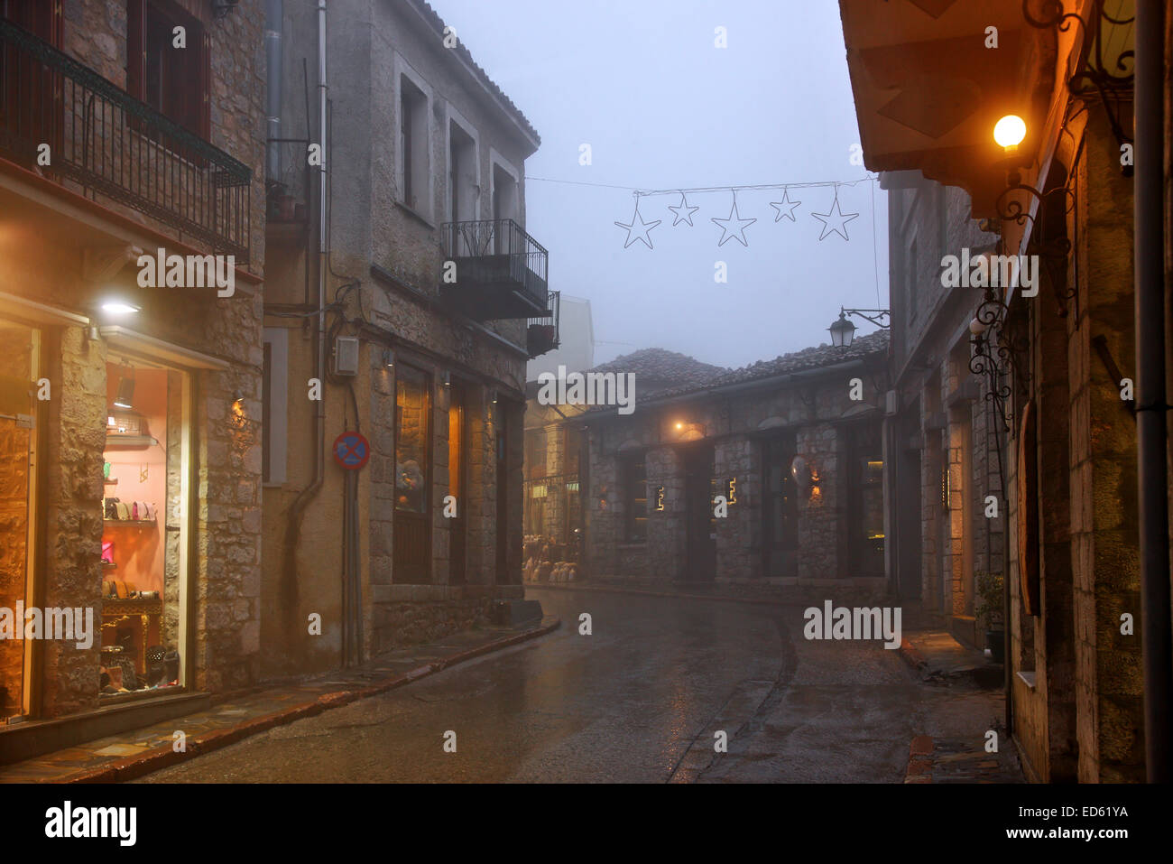 Night falling on misty Arachova, the most popular winter resort in Greece, Mount Parnassos, Viotia., Central Greece. Stock Photo