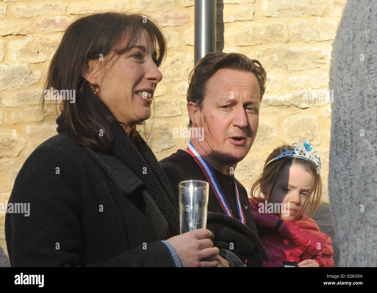 Chadlington, Oxfordshire, UK. 29th December, 2014. Prime Mininster David Cameron with his wife Samantha and daughter Florence after competing in The Great Brook Run which starts and finishes at The Tite Inn, Chadlington, Oxfordshire, UK.  Credit:  Denis Kennedy/Alamy Live News Stock Photo