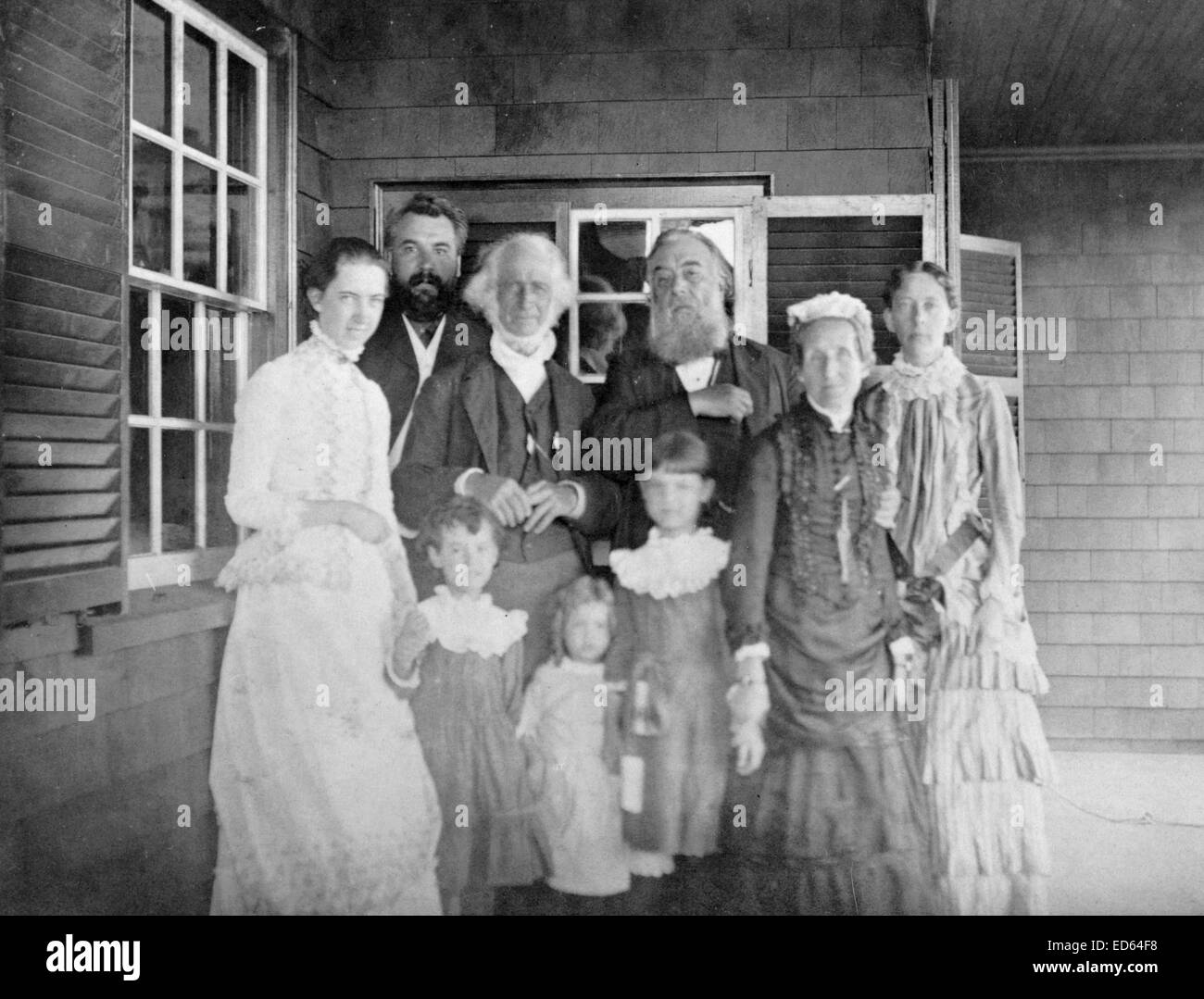 Mabel Hubbard Bell, Alexander Graham Bell, Dr. Bartol, Alexander Melville Bell, Eliza Grace Symonds, and Mary True with children, Daisy Bell, Gypsy Grossman, and Elsie Bell at the Hubbard home in Manchester, Mass., c1885, photographic print Stock Photo