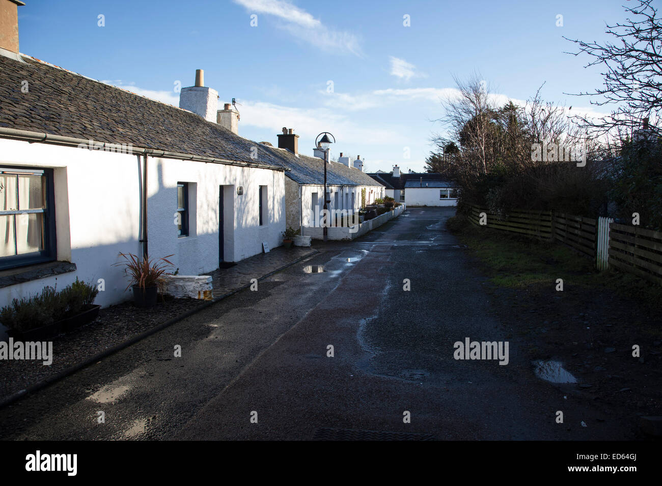 Rows of former slate quarry workers cottages in Ellenabeich near Oban in Scotland Stock Photo