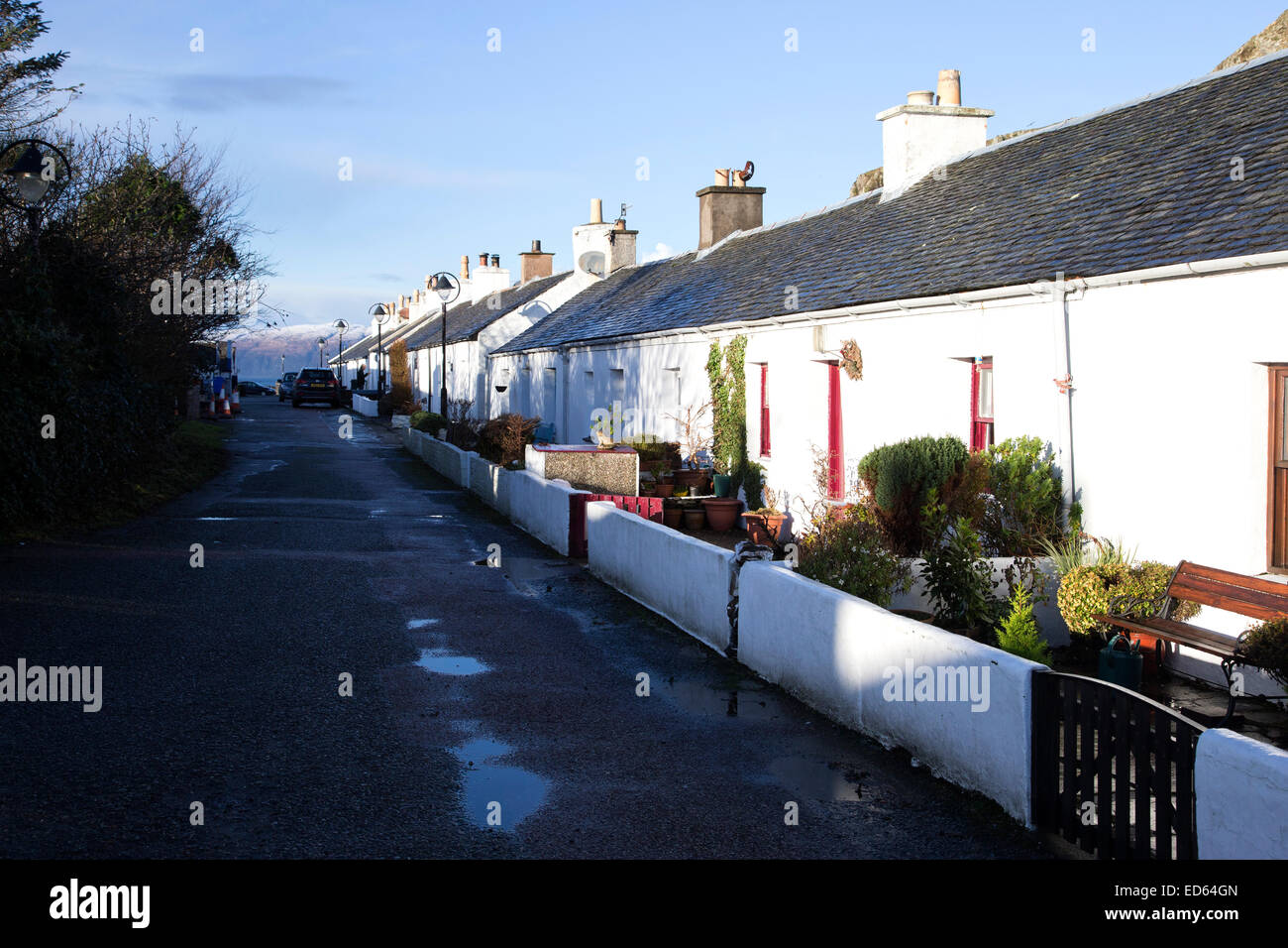 Rows of former slate quarry workers cottages in Ellenabeich near Oban in Scotland Stock Photo