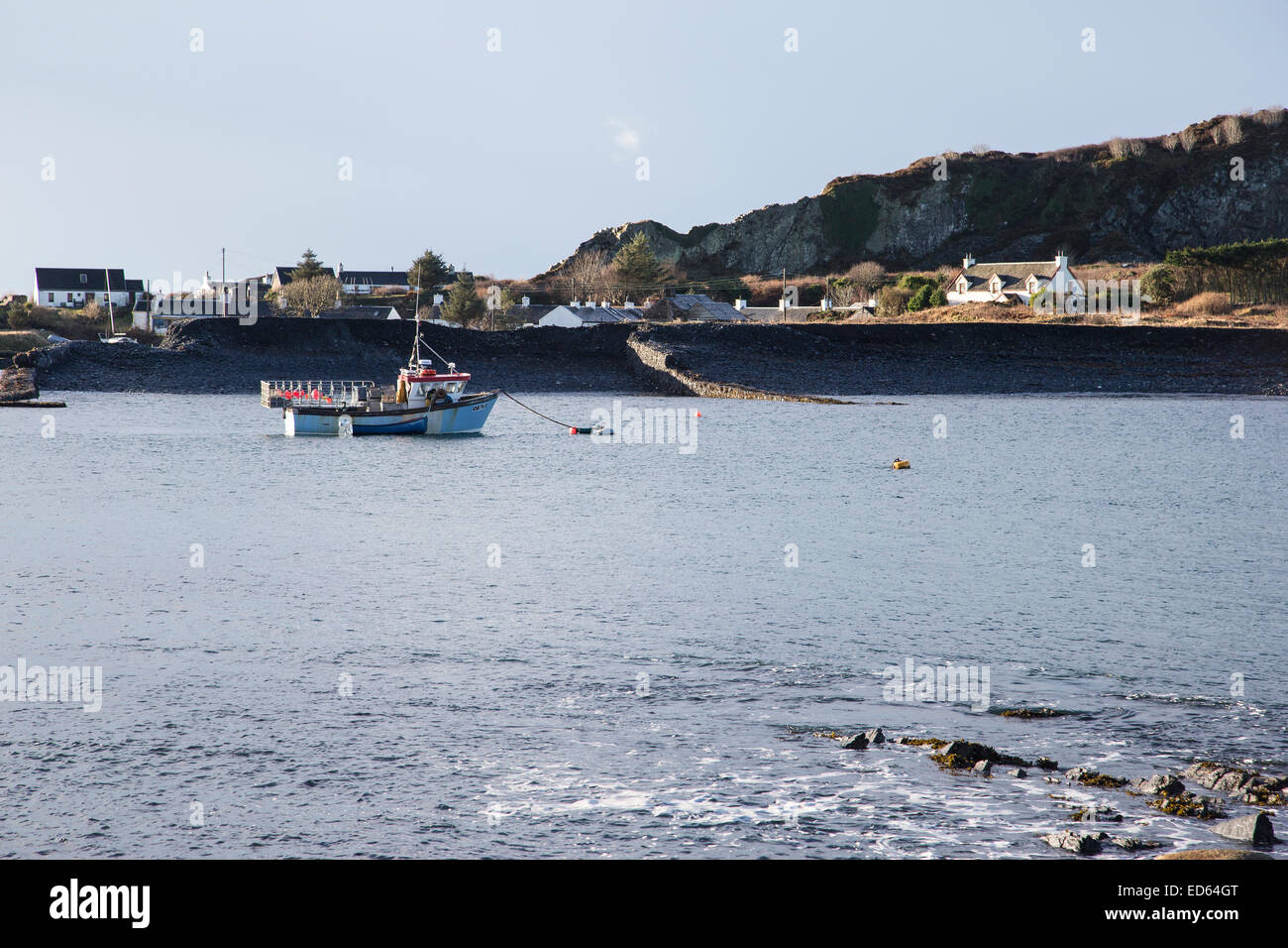 Scottish fishing boat at anchor in the inlet between Ellenabeich on Seil Island and Easdale Island Stock Photo