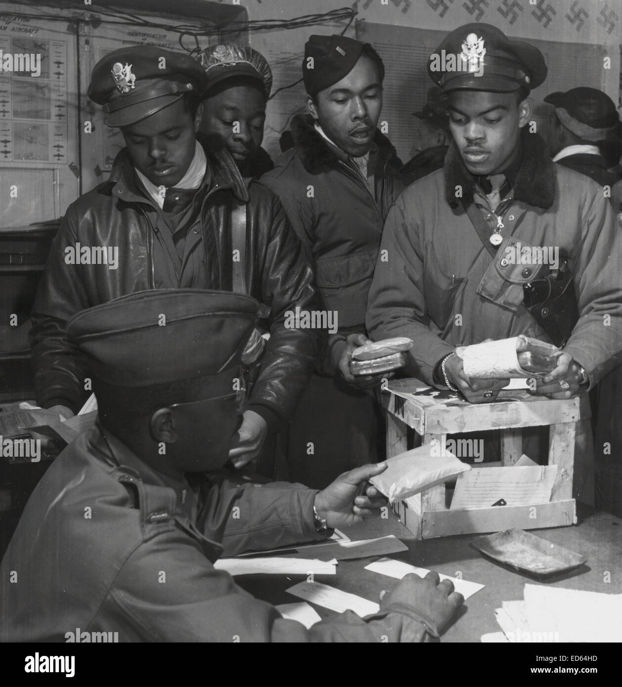 Tuskegee Airmen 332nd Fighter Group fighter pilots receive 'Escape kits' (cyanide)  in southern Italy, 1945 Stock Photo