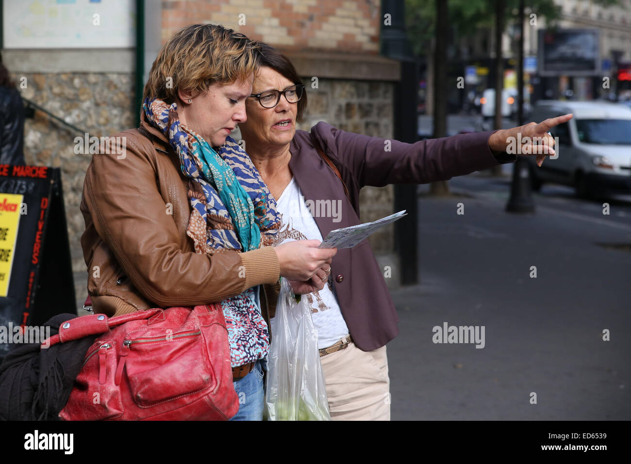 Paris two women tourist checking map Stock Photo