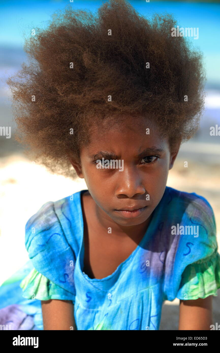 ESPIRITU SANTO,VANUATUOCTOBER 19, 2014 Local girl plays on the beach enjoying Sunday on