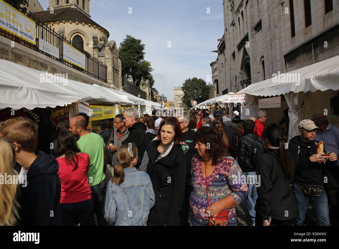 Paris street food vendor stall busy congested crowd people Stock Photo