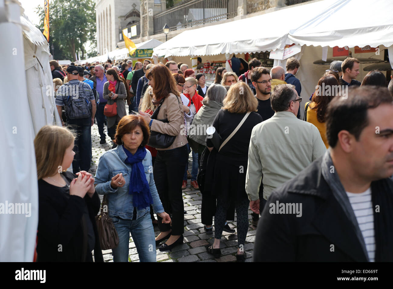 busy crowded people Paris street food stalls Stock Photo