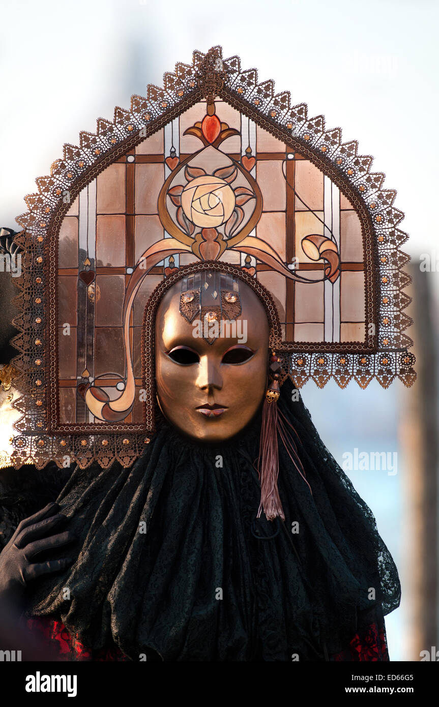 Portrait of woman in carnival costume in dark colors Stock Photo - Alamy