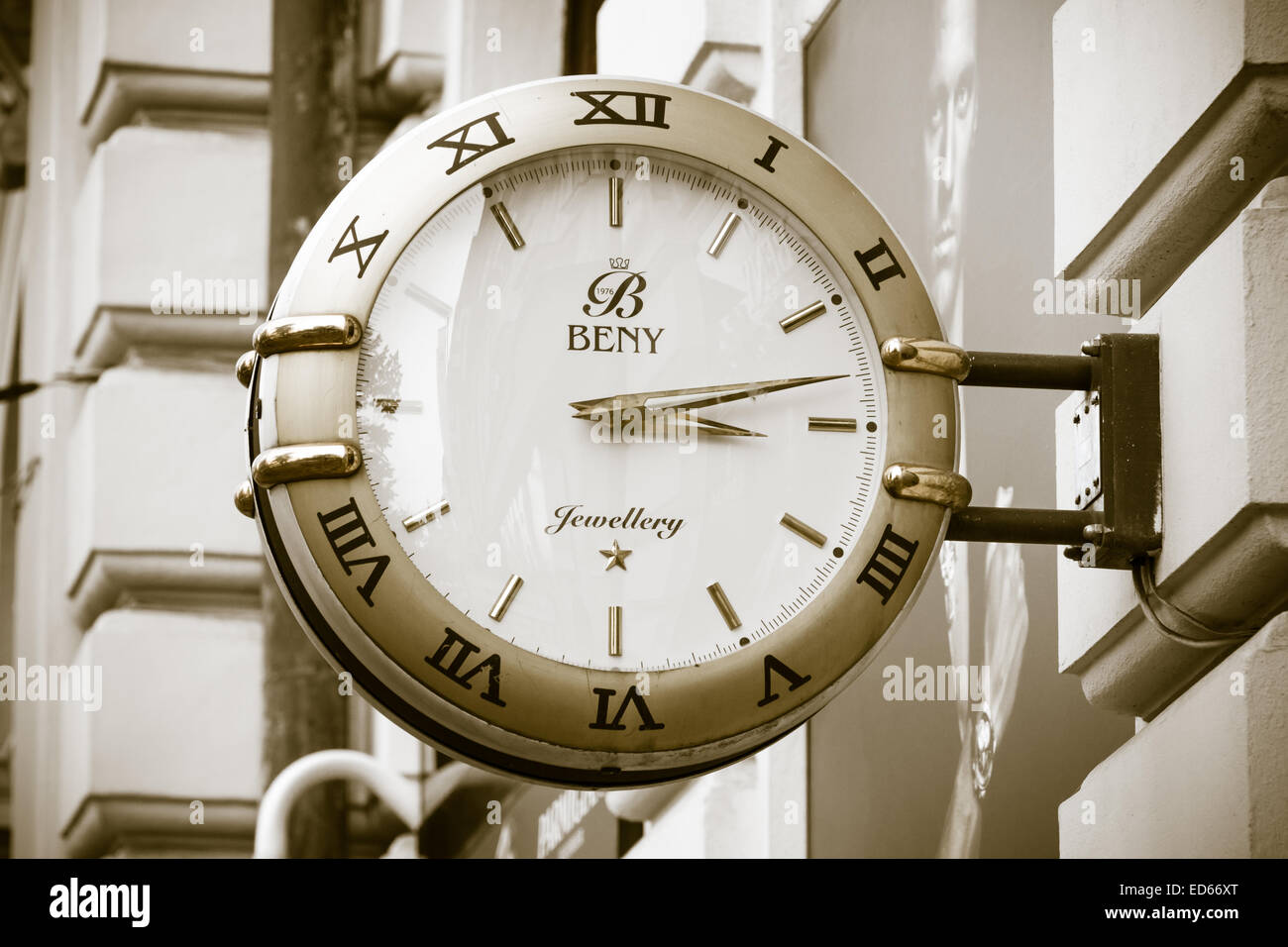 Signboard in the form of large wall clocks, shops selling watches, gold  jewelry and accessories "Beny". Sepia. Stylization Stock Photo - Alamy