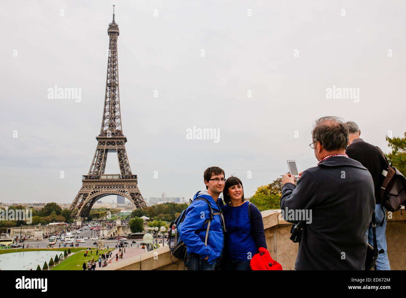 tourist taking picture Paris Eiffel tower Stock Photo