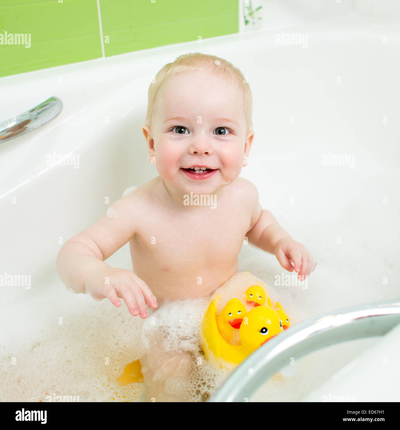 Child taking a bubble bath hires stock photography and images Alamy