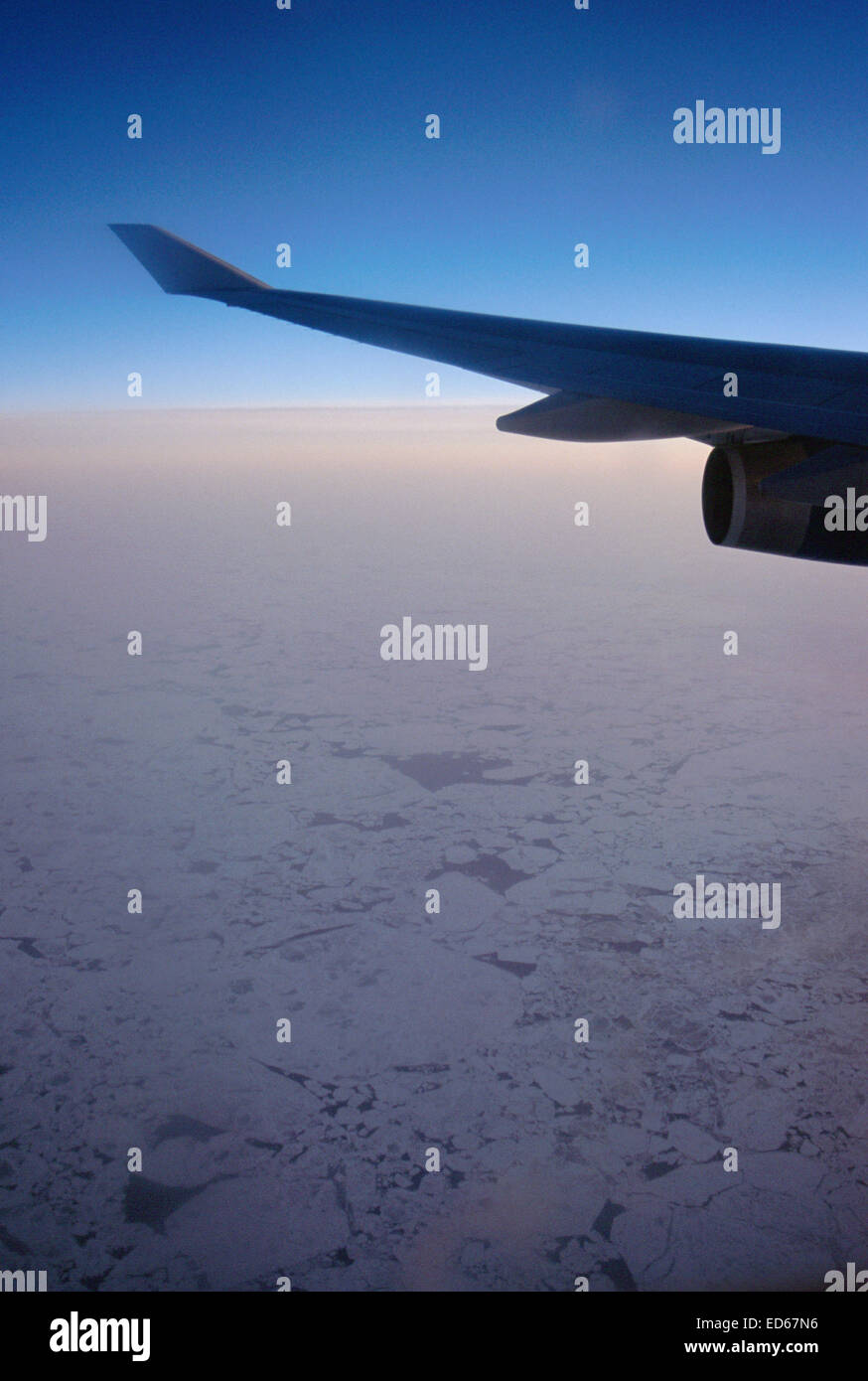 Airplane wing and sea ice on sunset, North pole Stock Photo Alamy