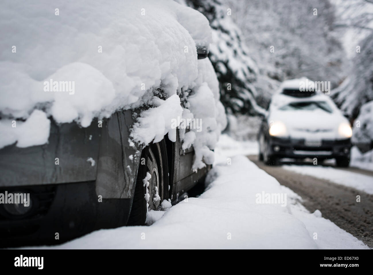 Zurich, Switzerland. 29th Dec, 2014. Car drivers are struggling with snow and difficult driving conditions on Zurich's streets after the onset of winter in Europe. Credit:  Erik Tham/Alamy Live News Stock Photo