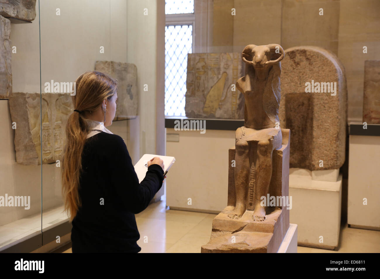 young girl sketching inside museum Stock Photo