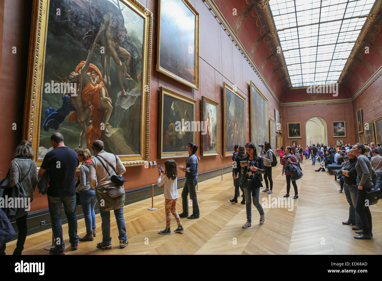 tourists inside Louvre museum art paintings Stock Photo