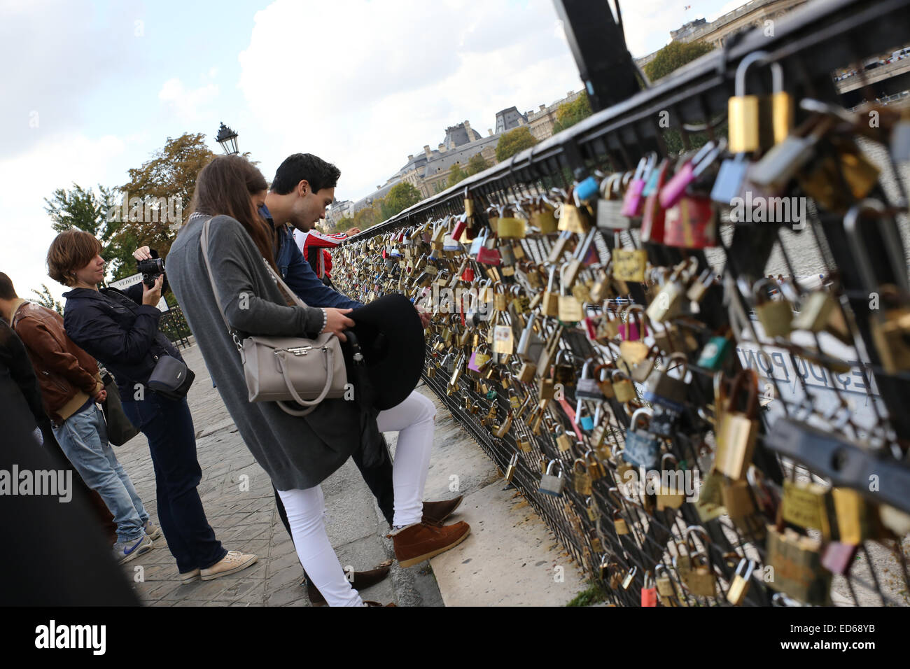 man woman people love lock bridge Paris Stock Photo