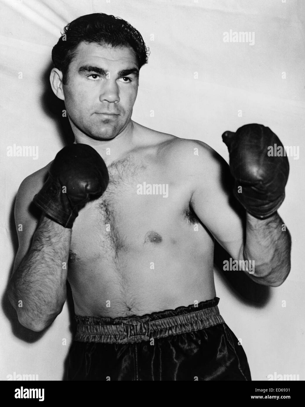 Max Schmeling wearing boxing trunks and gloves, 1938 Stock Photo