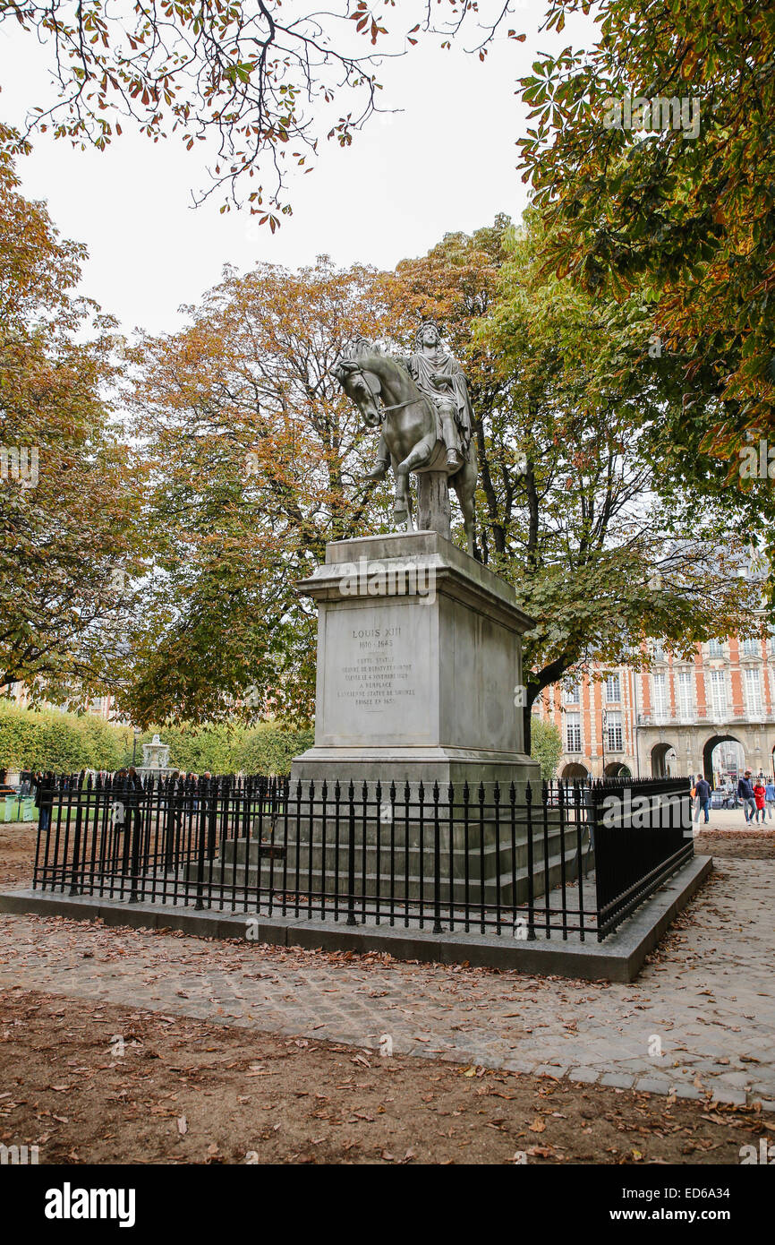 man riding horse statue Place des Vosges Stock Photo