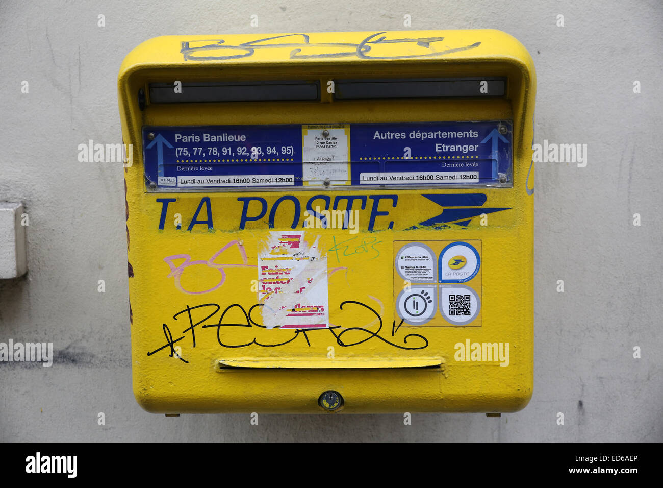 Paris yellow post mail box Stock Photo