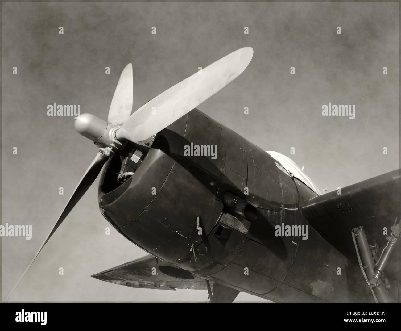 Retro propeller airplane nose view old stained black and white Stock