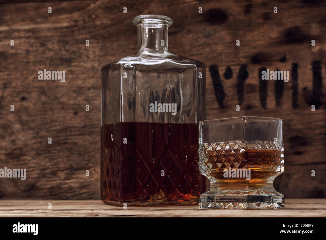 seasoned brandy into the glasses and decanter vintage style Stock Photo Alamy