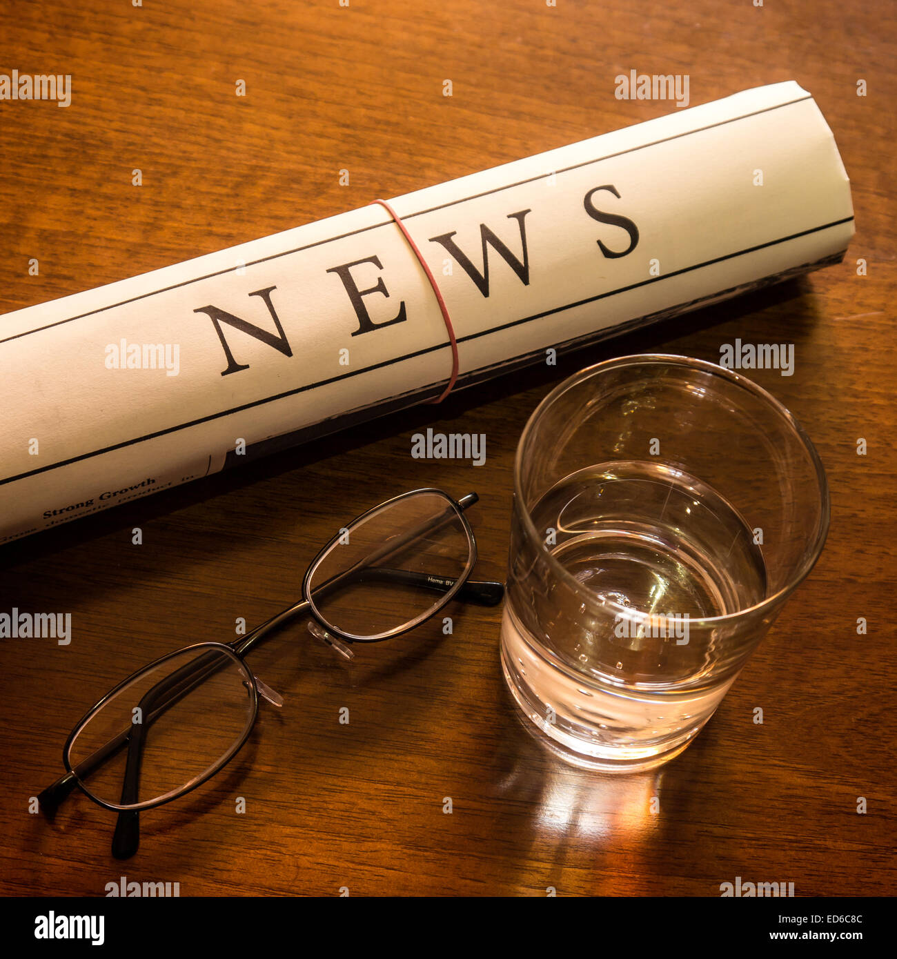 newspaper, glass water, glasses on desk Stock Photo Alamy