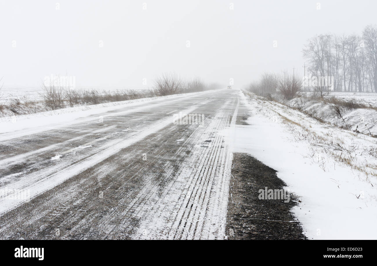 Winter landscape with empty highway and snow-drift Stock Photo