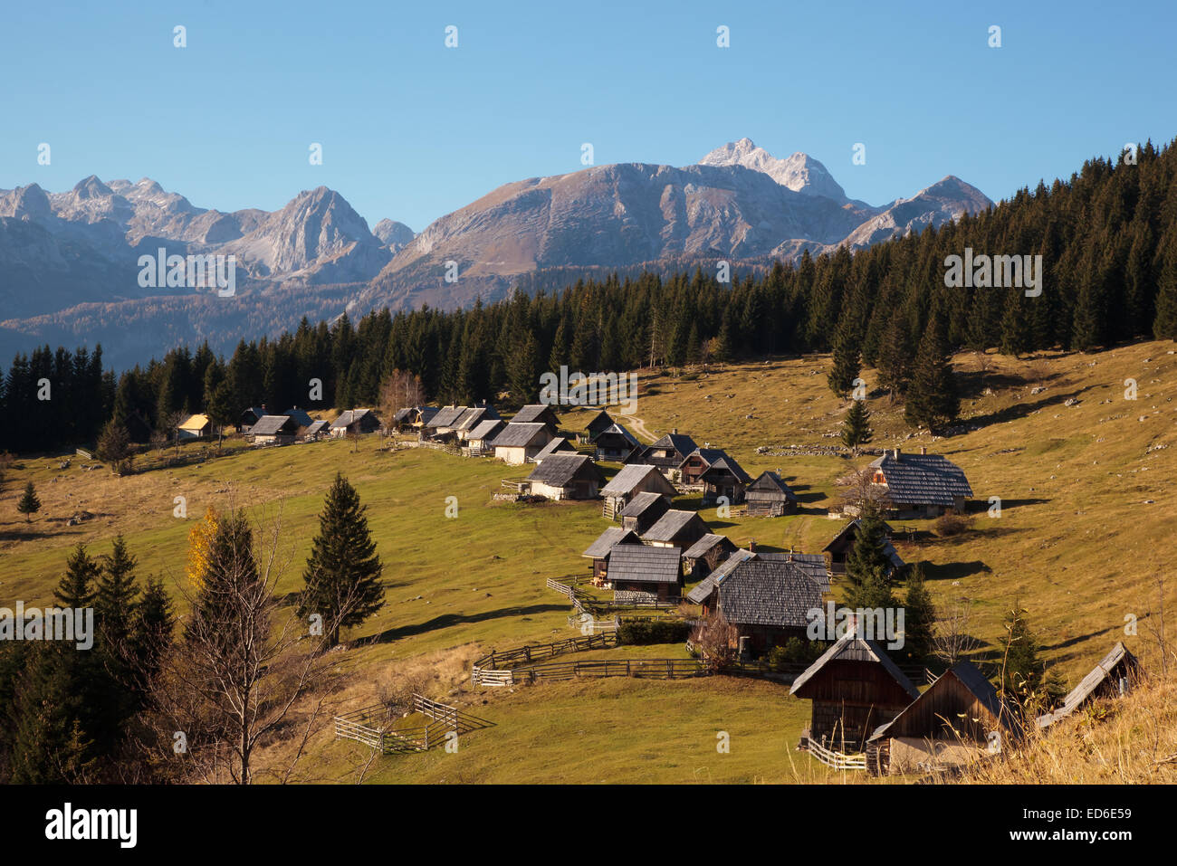 Idyllic shepherds' cottages on Zajamniki meadow in Slovenia Stock Photo