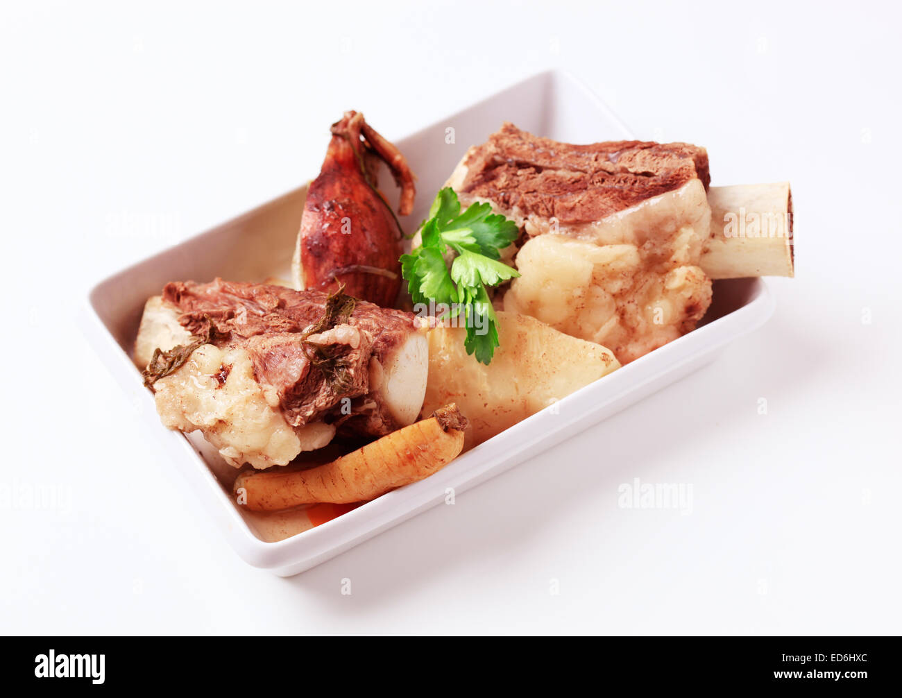 Boiled beef and root vegetables in a porcelain dish Stock Photo - Alamy