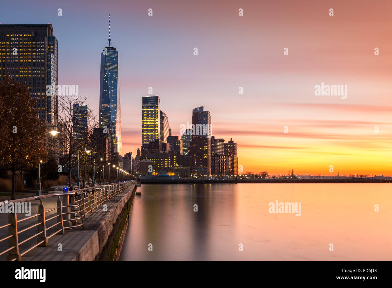 Lower Manhattan at sunset as viewed from Hudson River Park, in Tribeca, New York - with space for text on the right Stock Photo