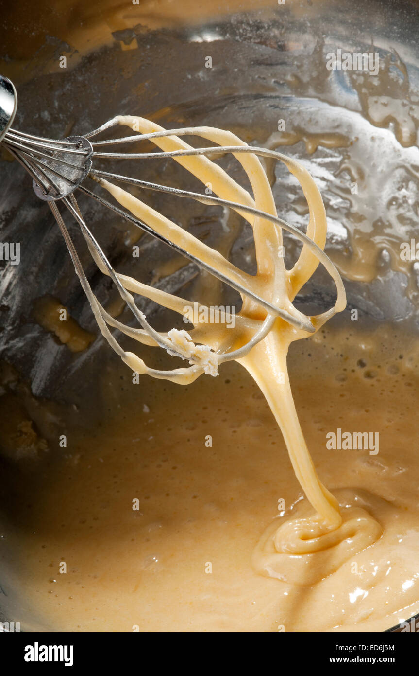 whisk preparing cupcake flour egg and butter in a bowl Stock Photo
