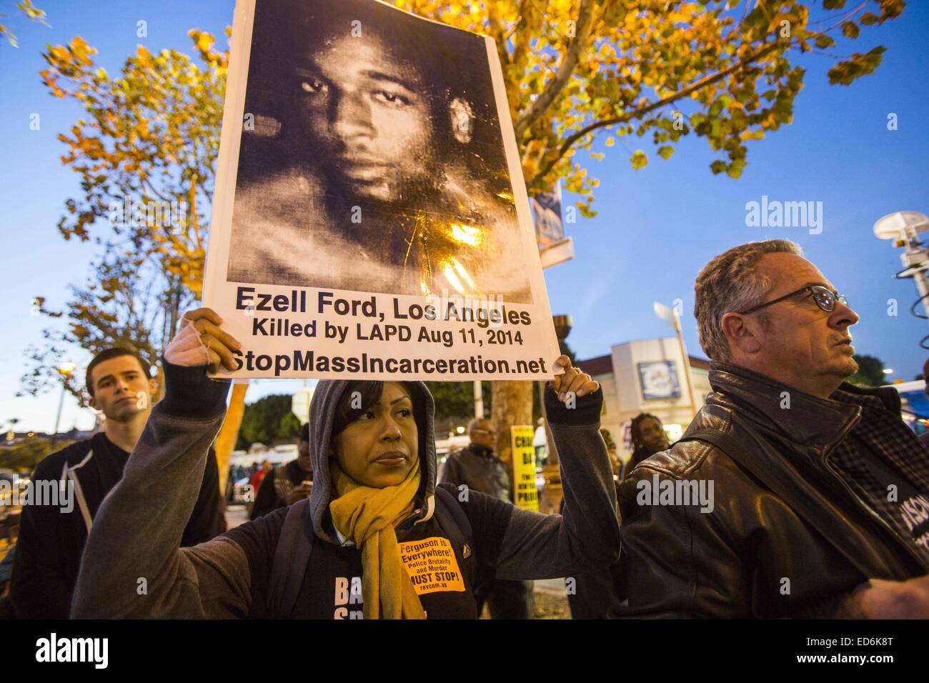 Los Angeles, California, USA. 29th Dec, 2014. Demonstrators march after an autopsy report released on the Ezell Ford shooting on Monday. The Ford shooting death by Los Angeles police sparked months of protests and calls by community activists for a transparent investigation. Ford was shot once in the right side of his back, once in the right arm and once in the right abdomen, according to an autopsy released today. © Ringo Chiu/ZUMA Wire/Alamy Live News Stock Photo