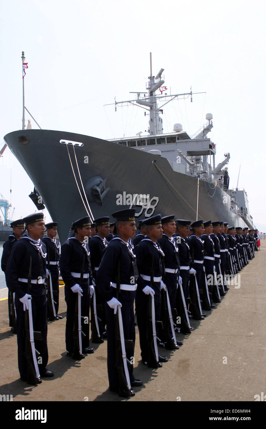Callao, Peru. 29th Dec, 2014. Members of the Peruvian War Navy participate in the ceremony of the incorporation of the Logistic Support Vessel B.A.P. Tacna to Peru's Navy, in the Naval Base of the constitutional province of Callao, department of Lima, Peru, on Dec. 29, 2014. © Luis Camacho/Xinhua/Alamy Live News Stock Photo