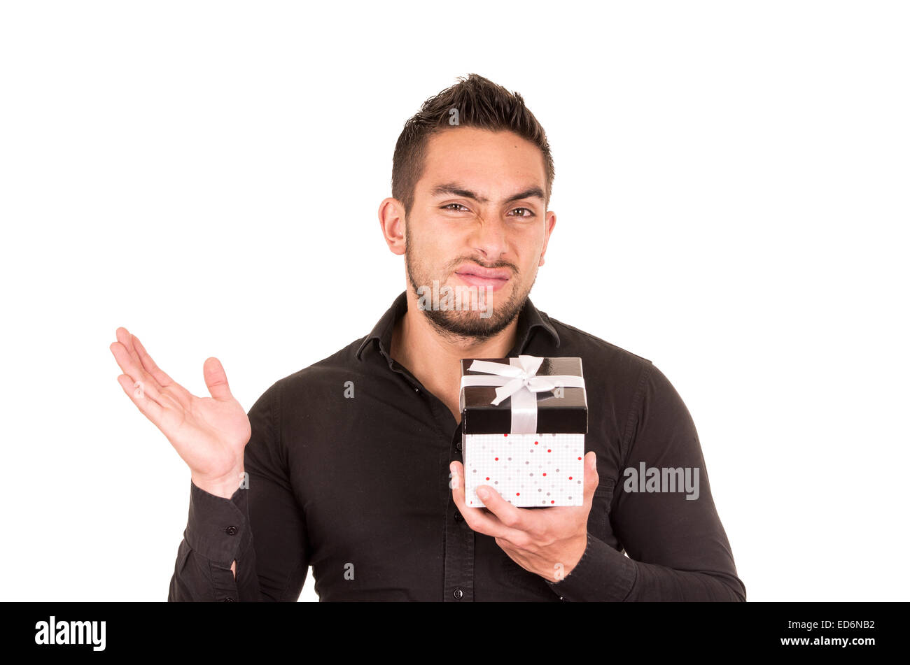 unimpressed young man holding a gift box Stock Photo Alamy