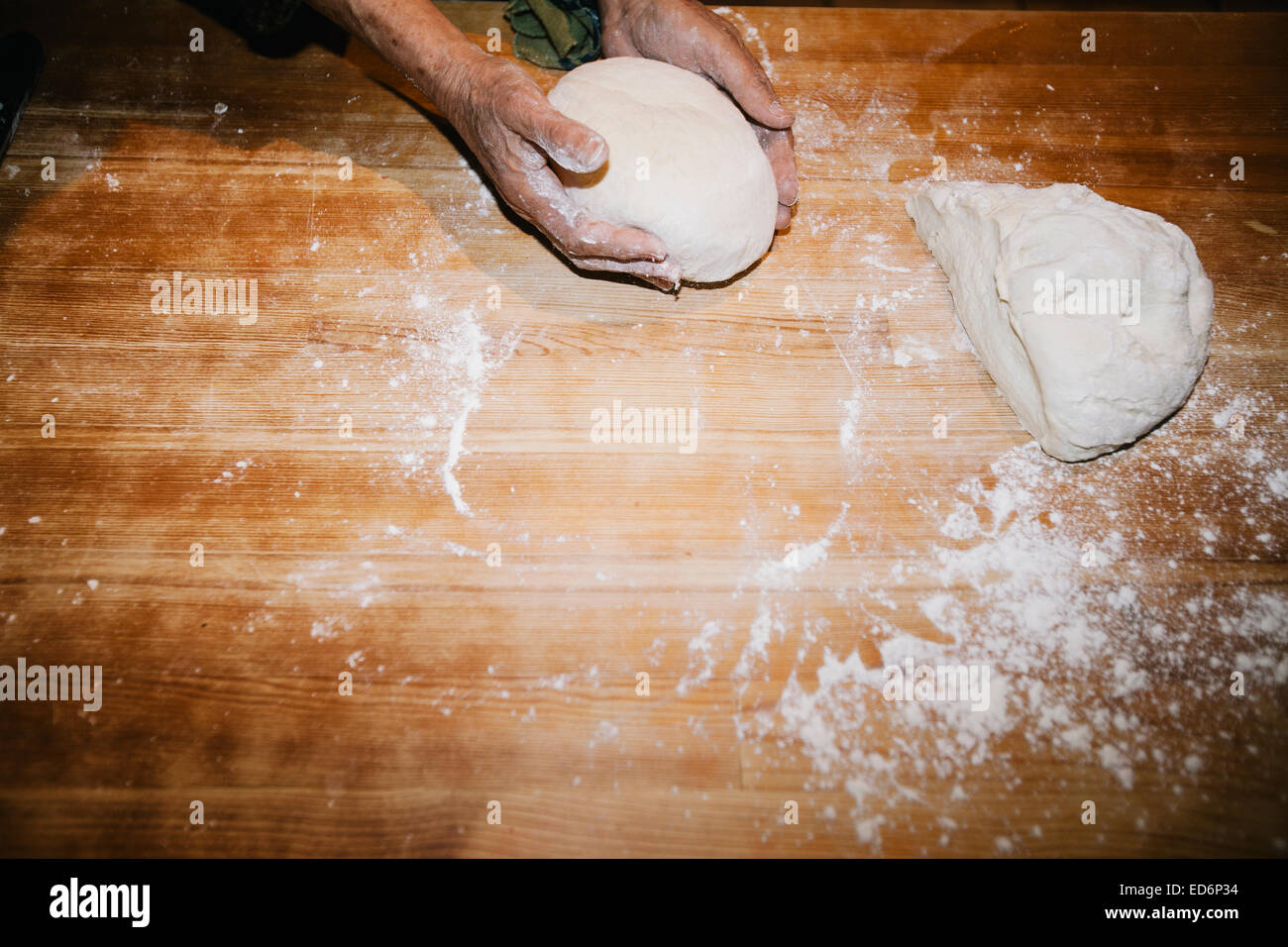 Hands kneading wheat bread dough on a wooden table Stock Photo Alamy