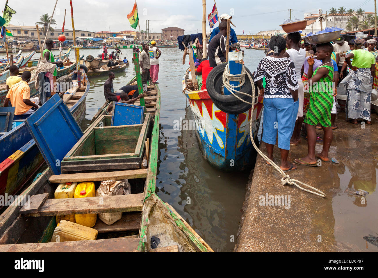 Fishing boats unloading at Elmina, Ghana, Africa Stock Photo