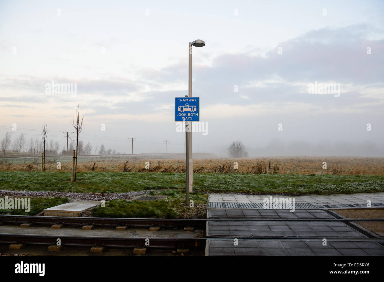 A sign at Ingliston Park & Ride and Edinburgh Tram station reads; Tramway, Look both ways. Stock Photo