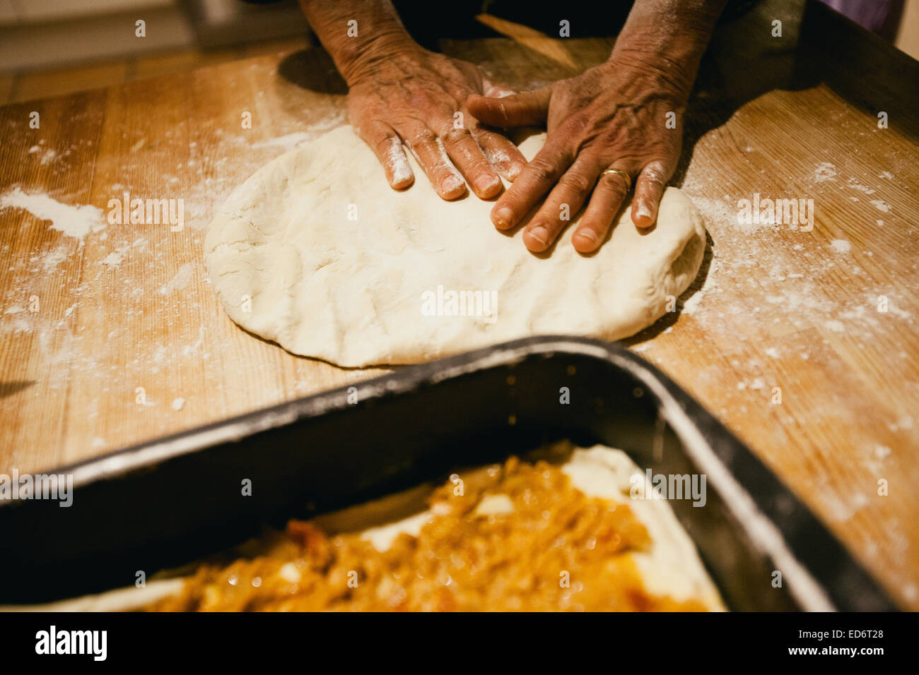 Hands kneading wheat bread dough on a wooden table Stock Photo Alamy