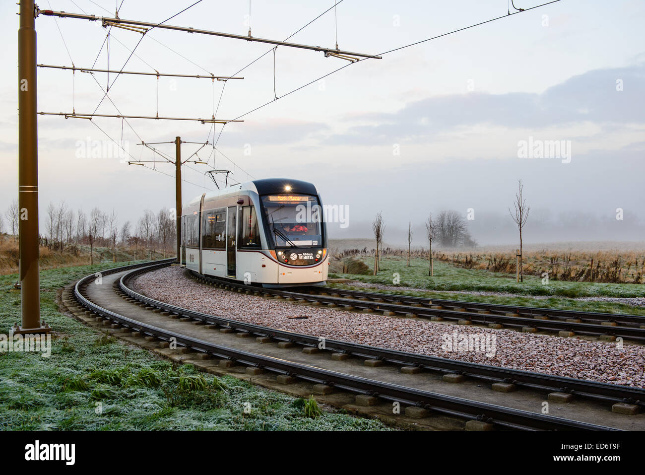 A tram rounds the corner at Ingliston Park & Ride, on it