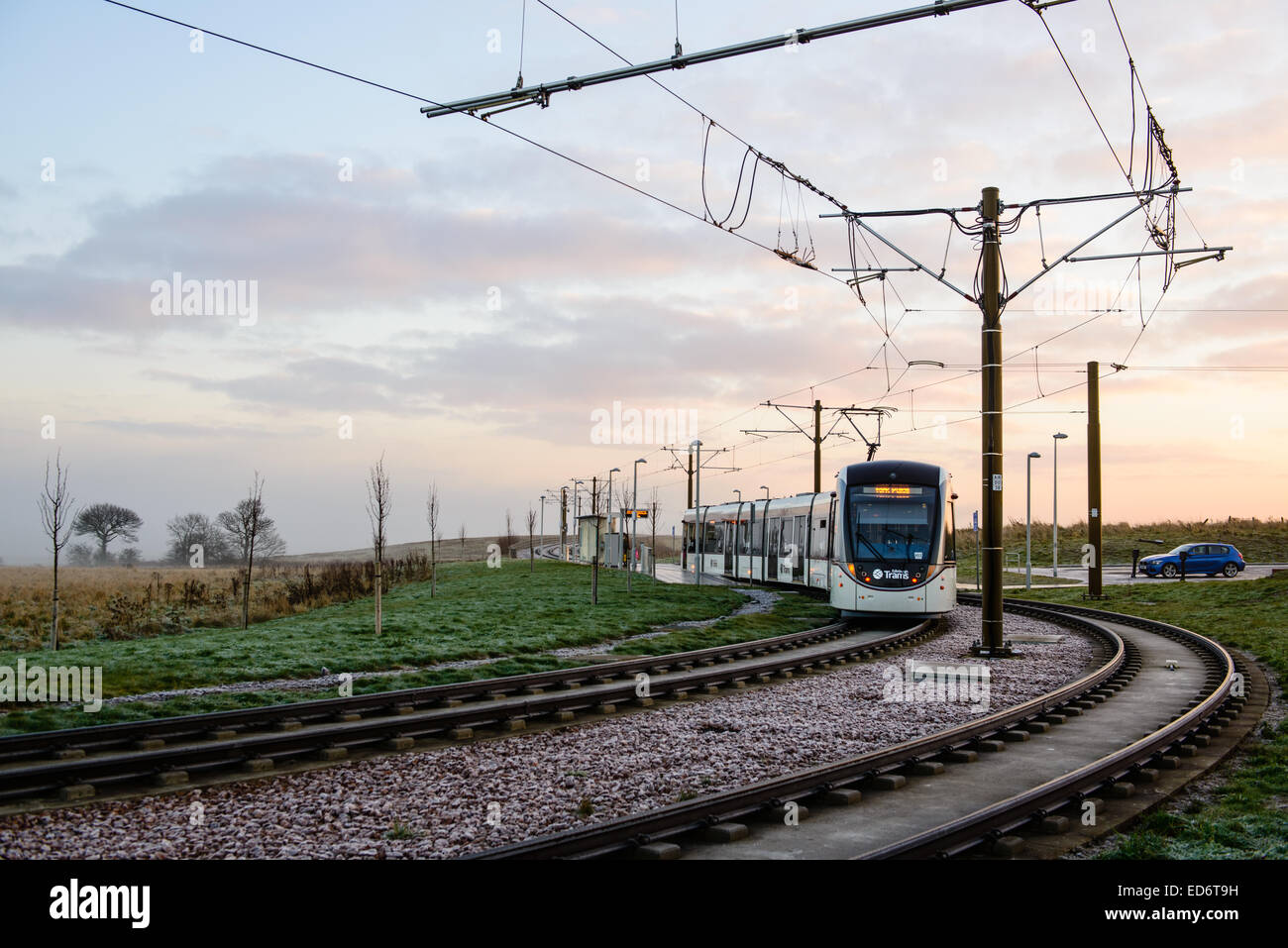 A tram rounds the corner at Ingliston Park & Ride, on it